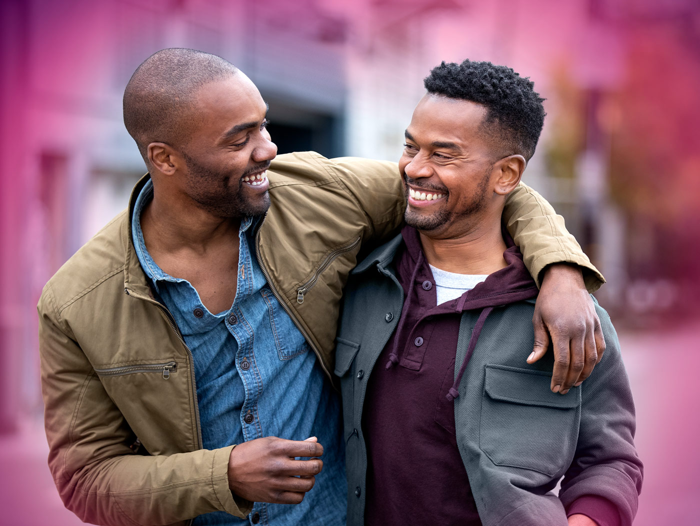 Two men smiling and in love